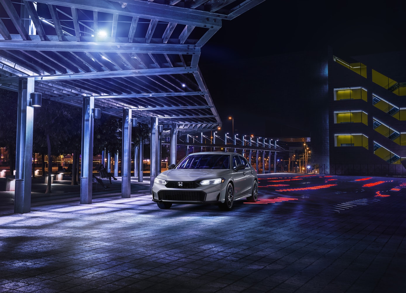  2026 Honda Civic Hybrid on the road at night