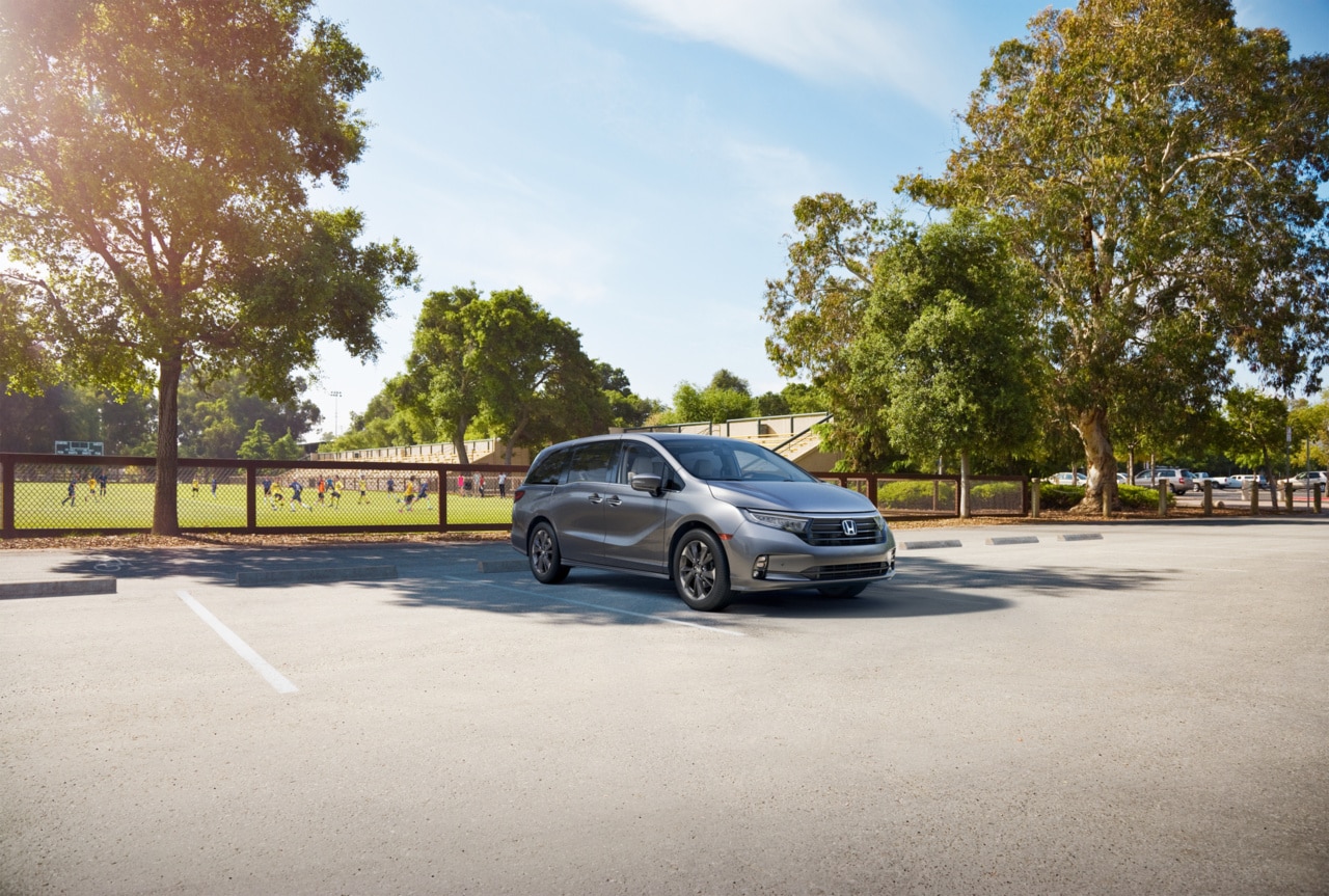 Honda Odyssey parked by soccer field