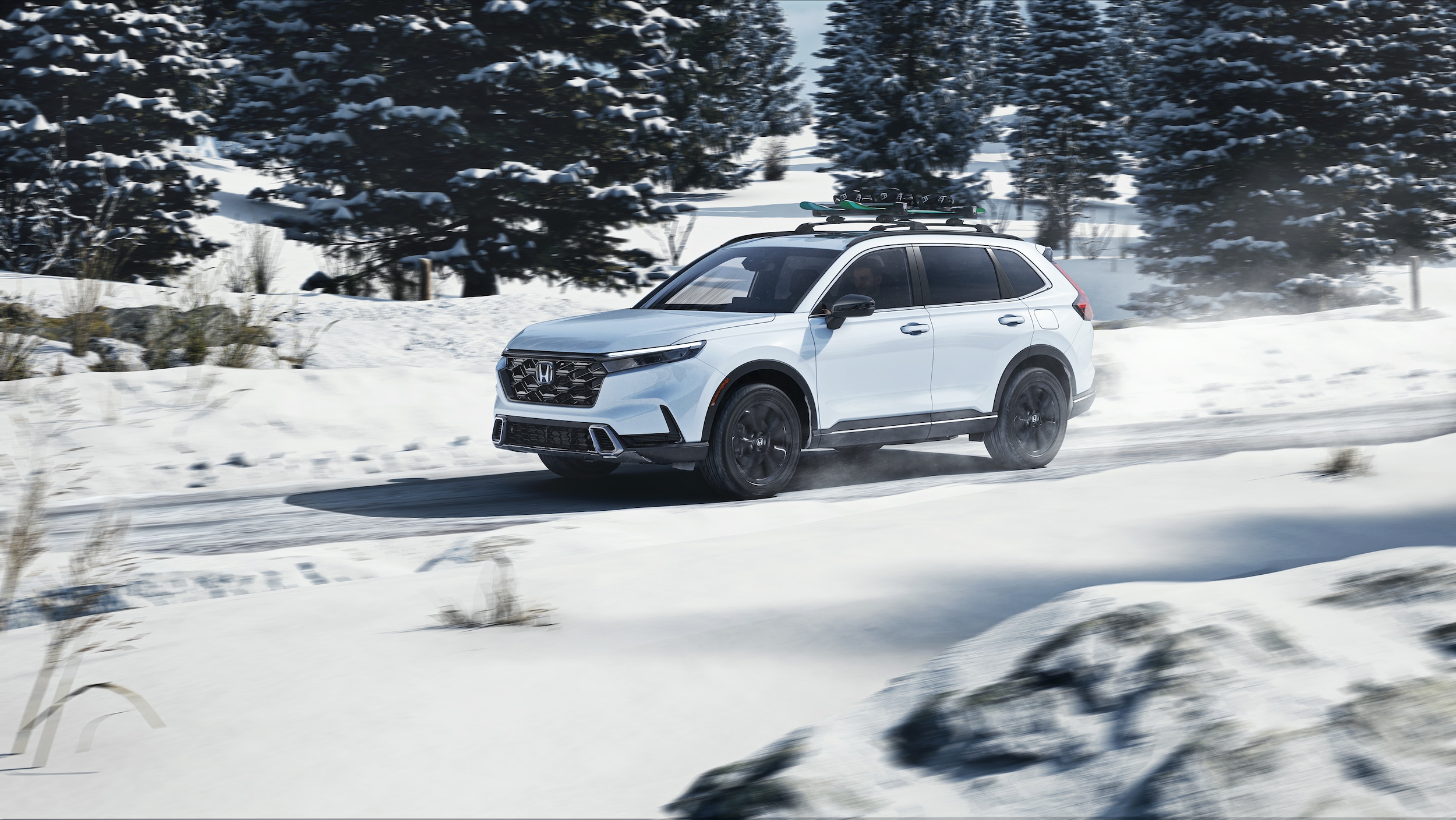Honda CR-V Hybrid driving on snowy road