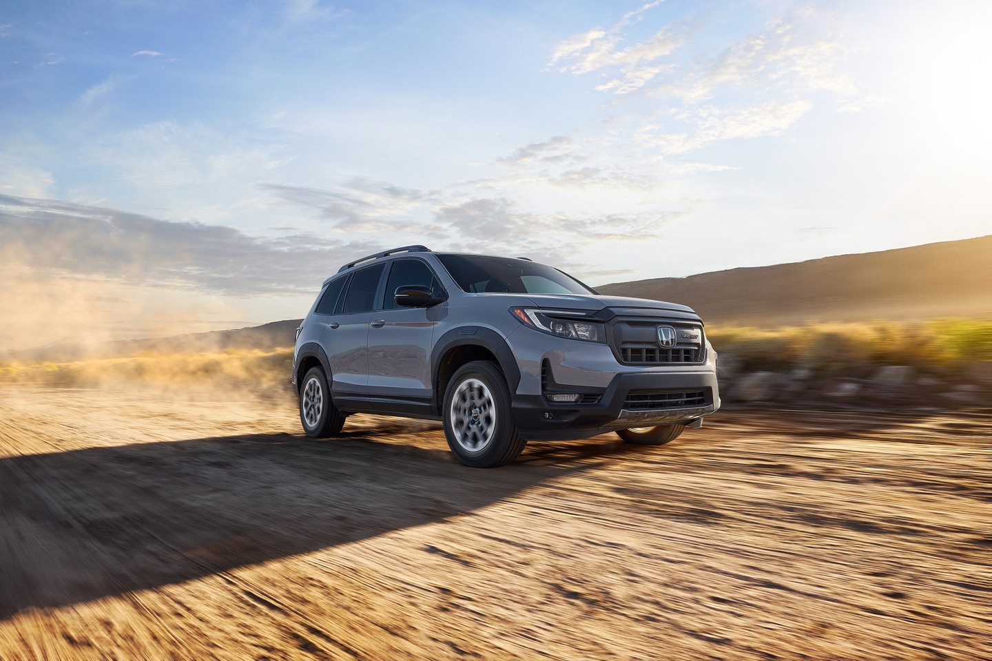 Honda Passport driving on dirt