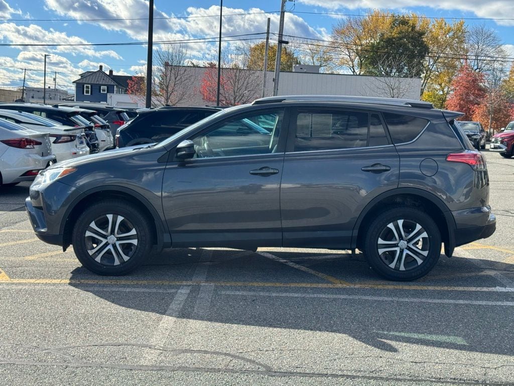 Certified 2018 Toyota RAV4 LE with VIN 2T3BFREV8JW770279 for sale in Milford, MA