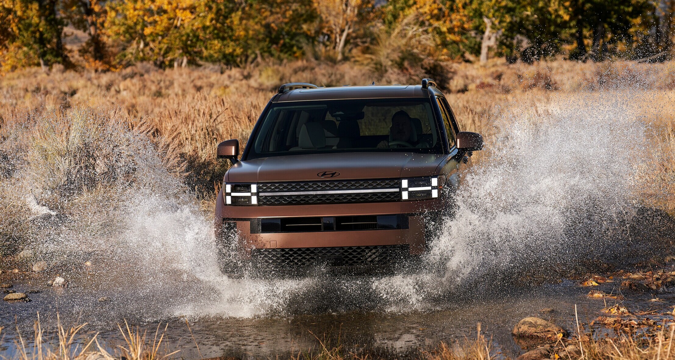 Hyundai Santa Fe driving through water