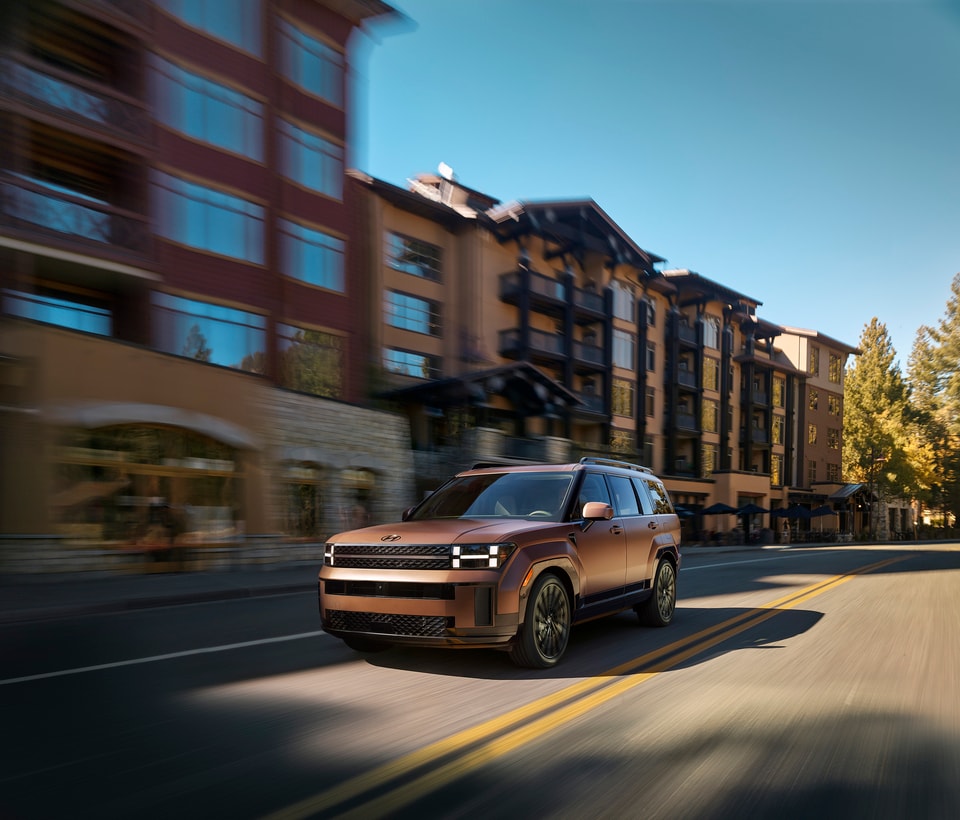  2026 Hyundai Santa Fe driving through town