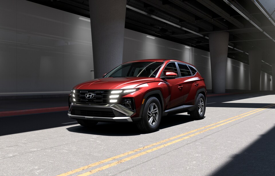  Red 2026 Hyundai Tucson Hybrid on the road