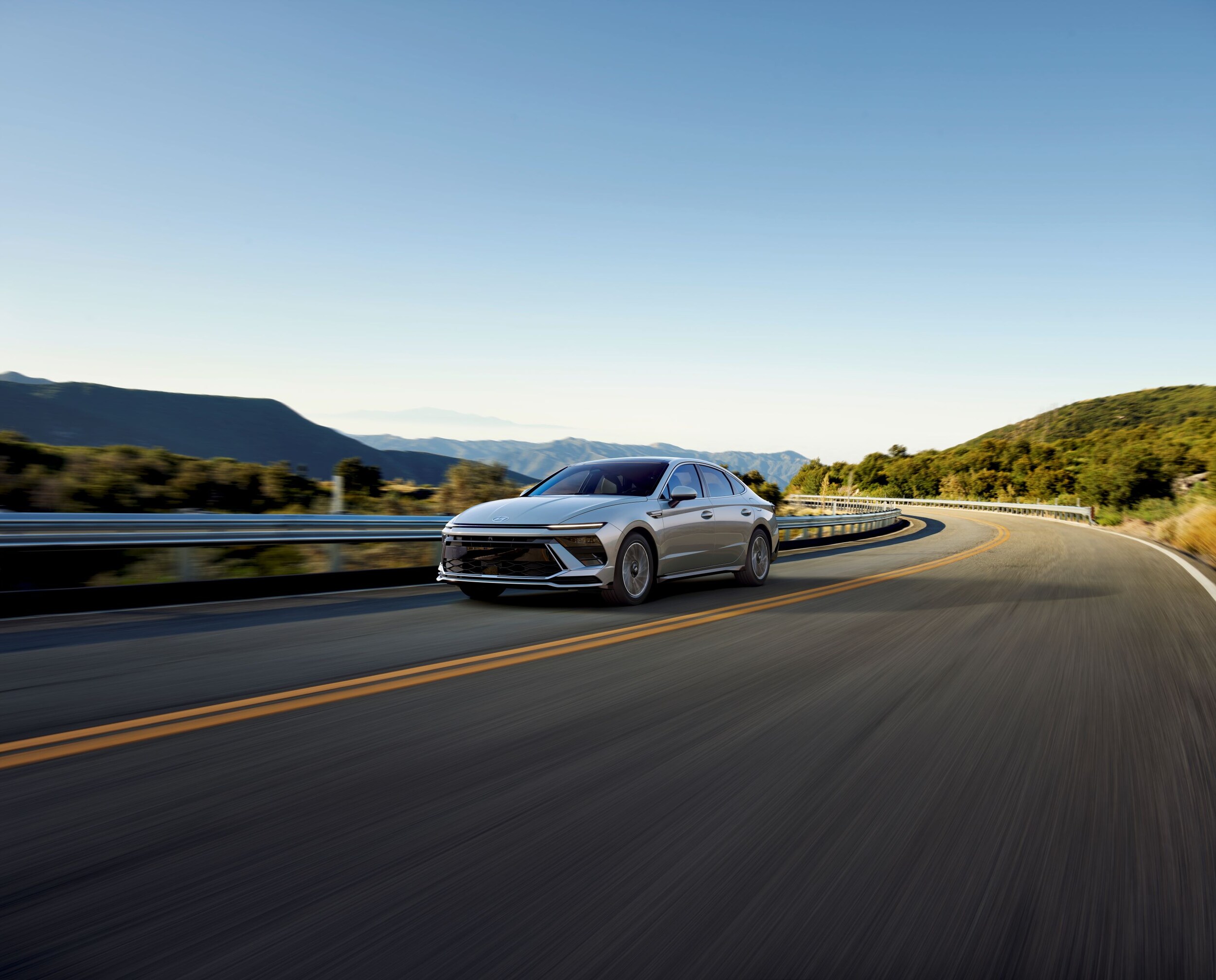 Hyundai Sonata Hybrid on highway through mountains