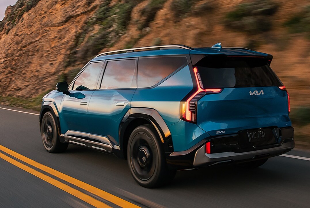  Blue Kia EV9 on the road