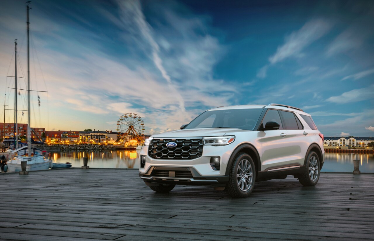 Ford Explorer parked by a beach boardwalk