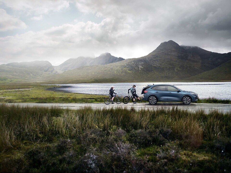 Ford Escape with bikers