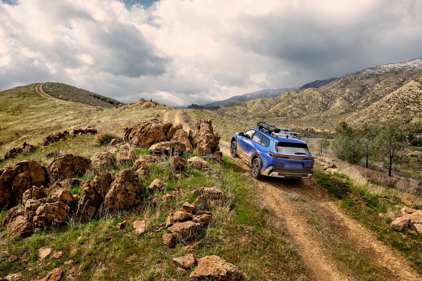Subaru Trailseeker driving on dirt road