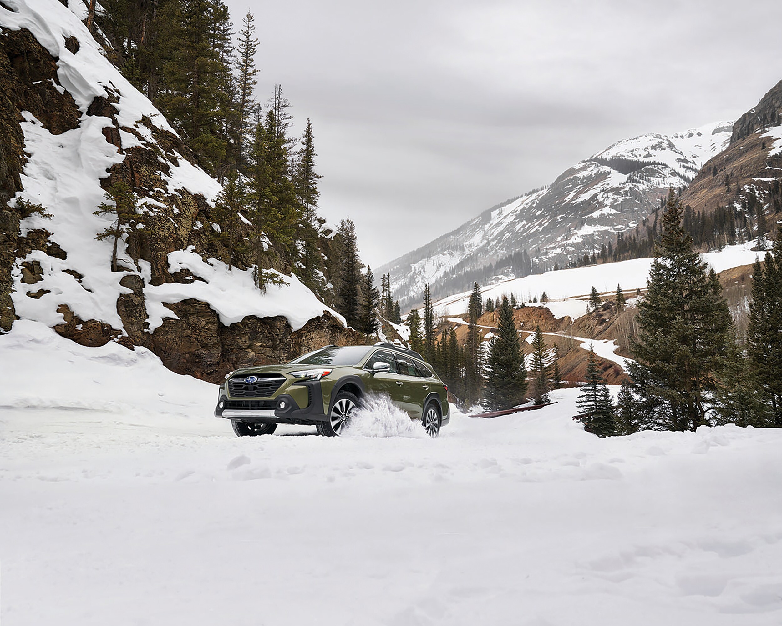 Subaru Outback driving in deep snow