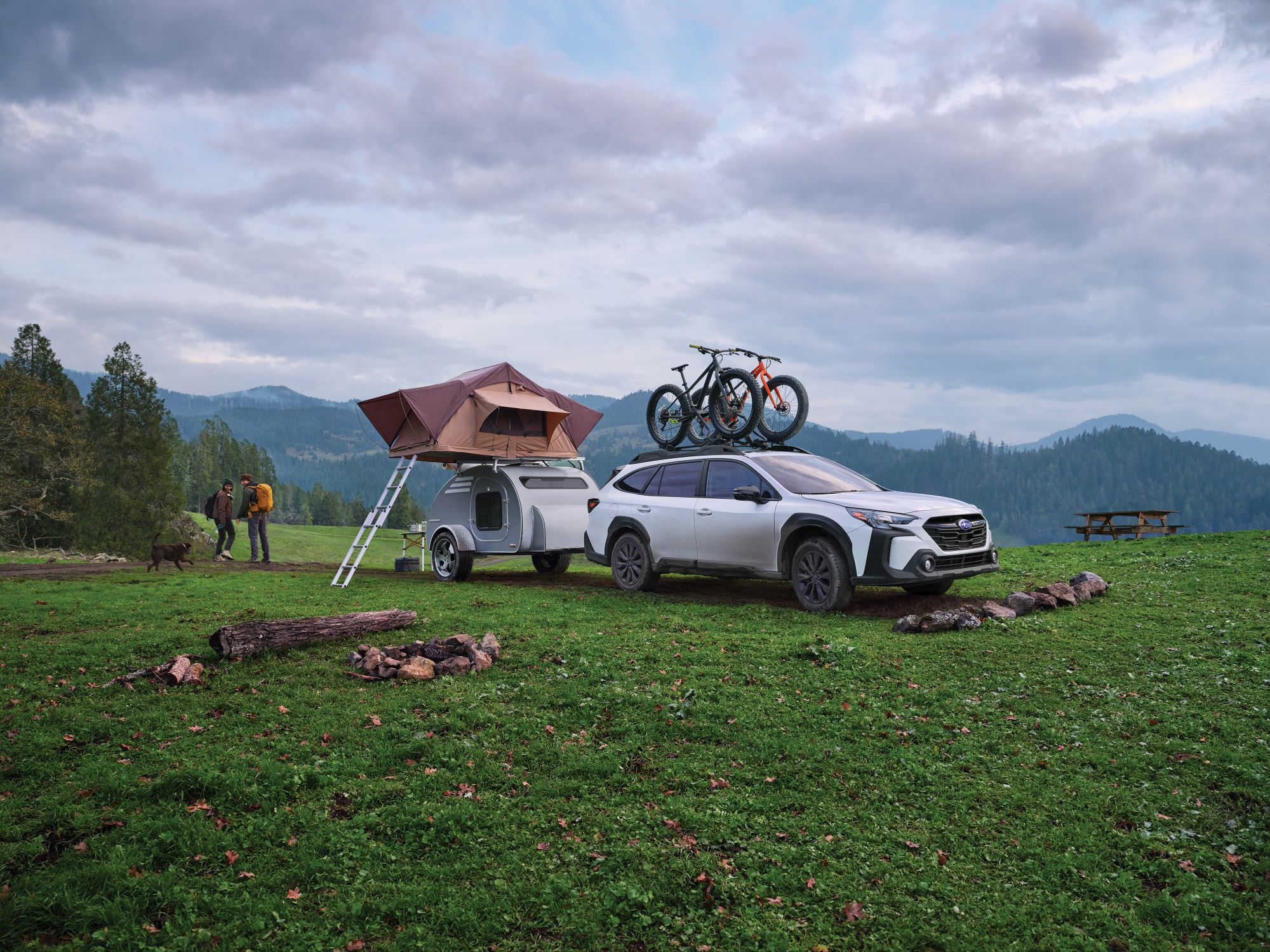  Subaru Outback Onyx Edition with camper at campsite