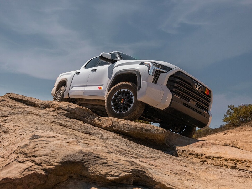  2026 Toyota Tundra driving on steep rocks