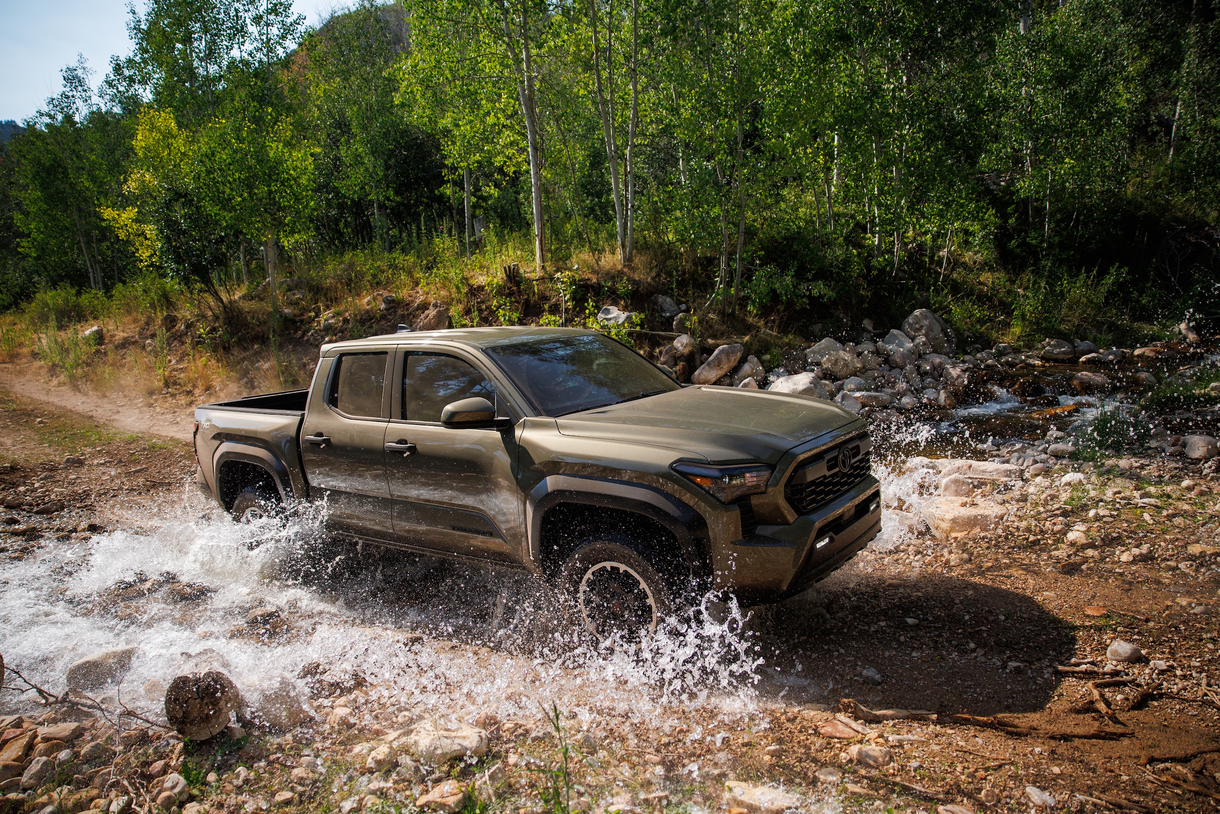 2026 Toyota Tacoma Hybrid driving through water