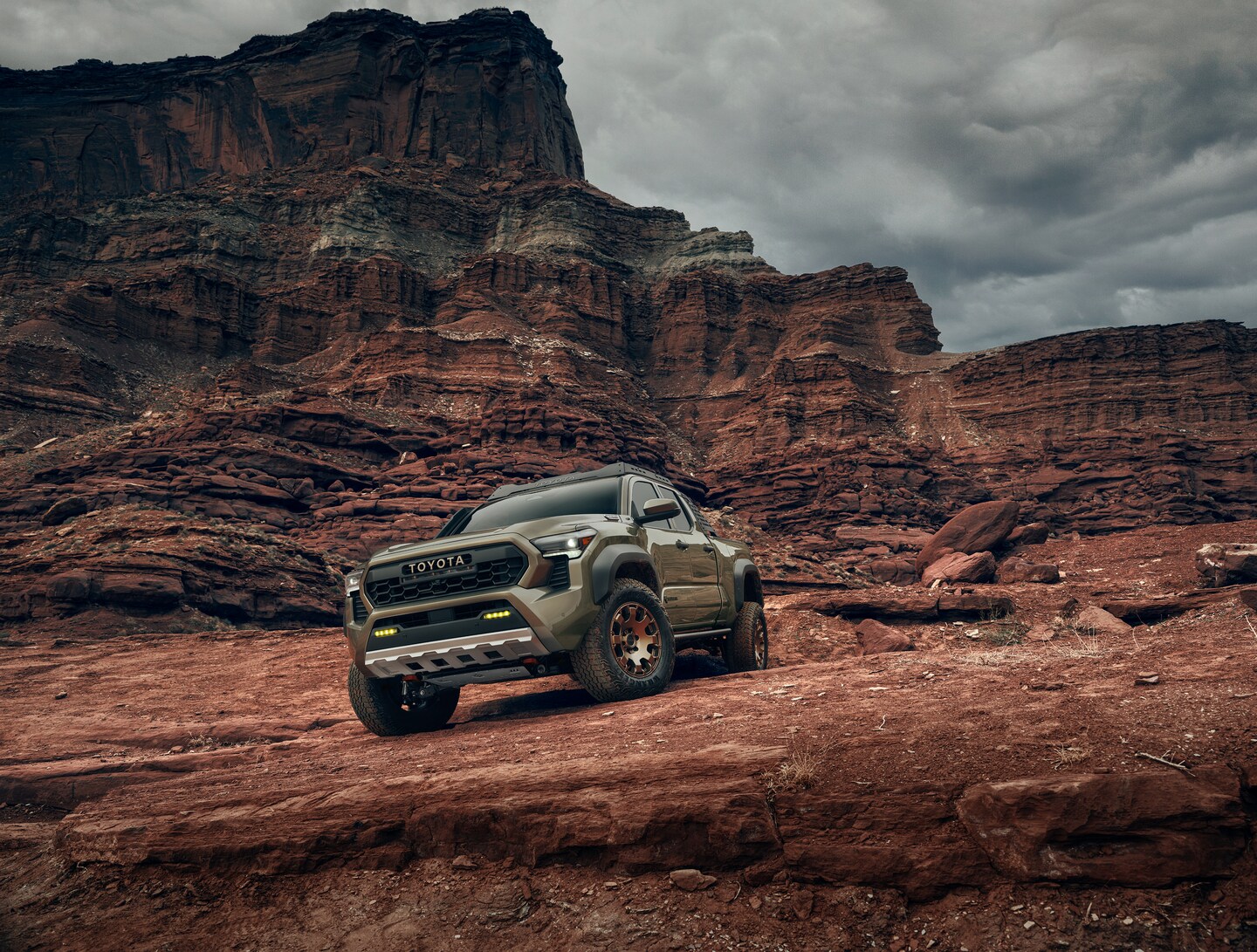 Toyota Tacoma on rocky trail by mountain view
