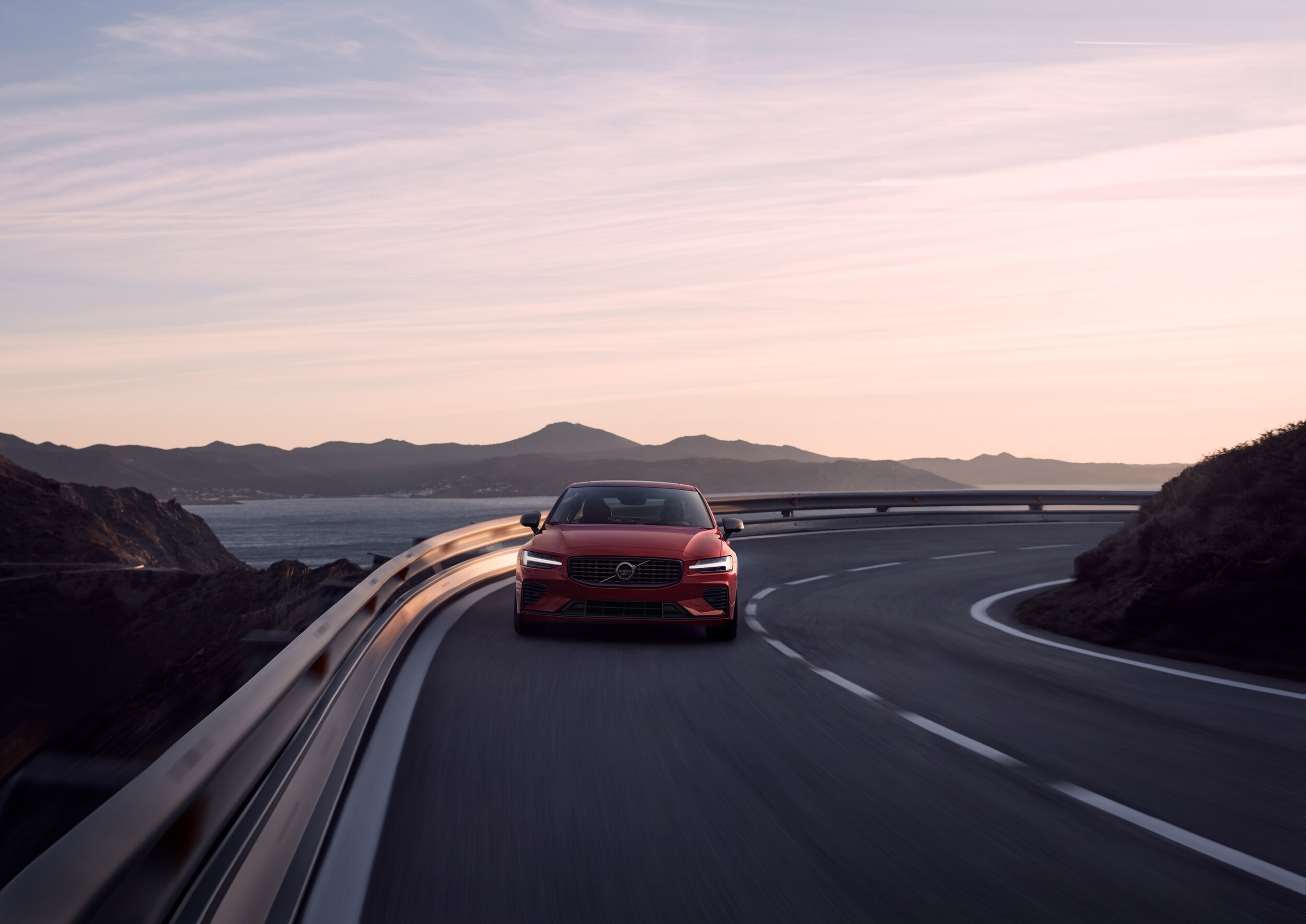  Volvo S60 on highway at sunset