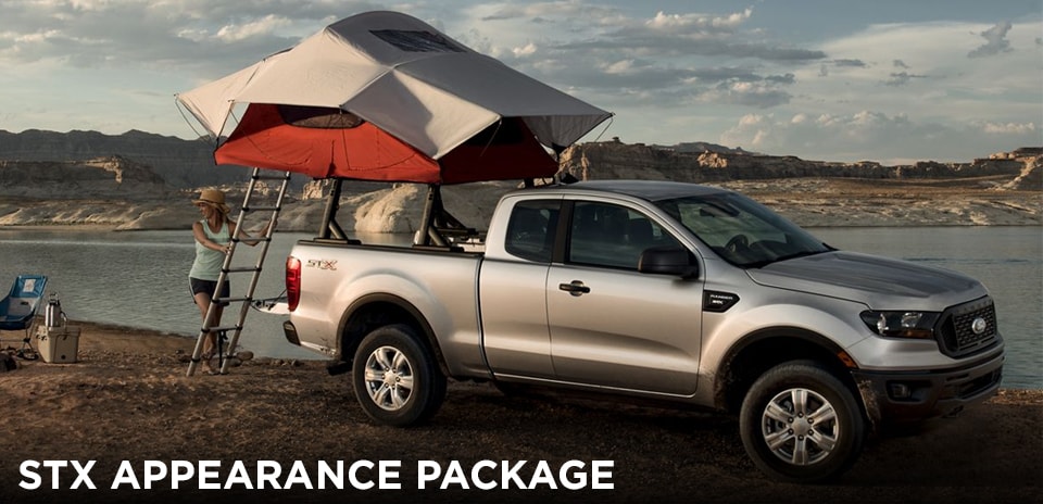 2019 Magnetic Ford Ranger STX Appearance Package with tent propped up on a river bank