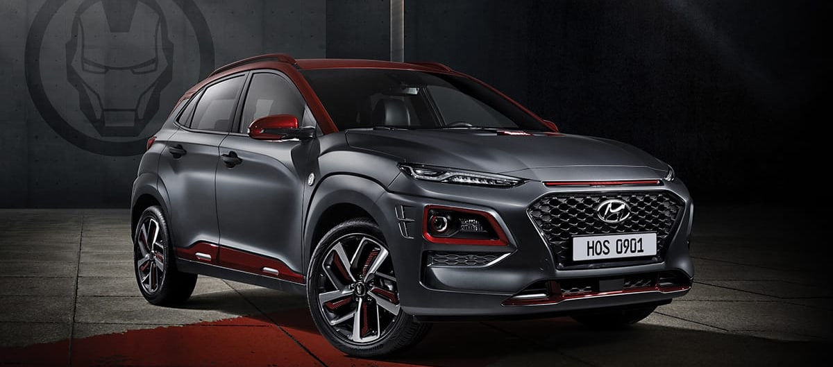 2019 Hyundai Kona Ironman Edition Gray and Ironman Red Exterior parked in a warehouse