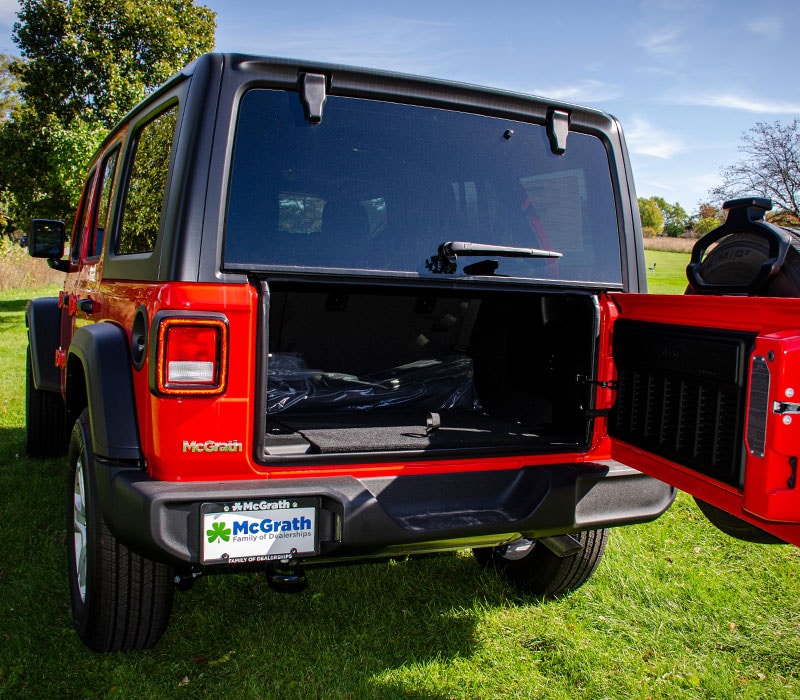 2020 Red Jeep Wrangler Exterior rear with tailgate open parked in a park