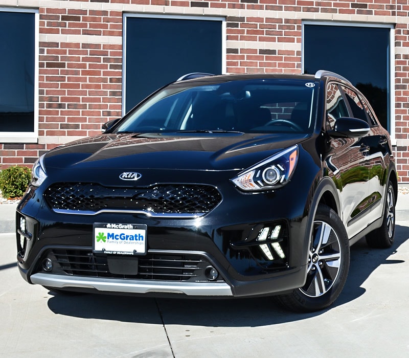 2020 Kia Nrio parked next to a building front exterior