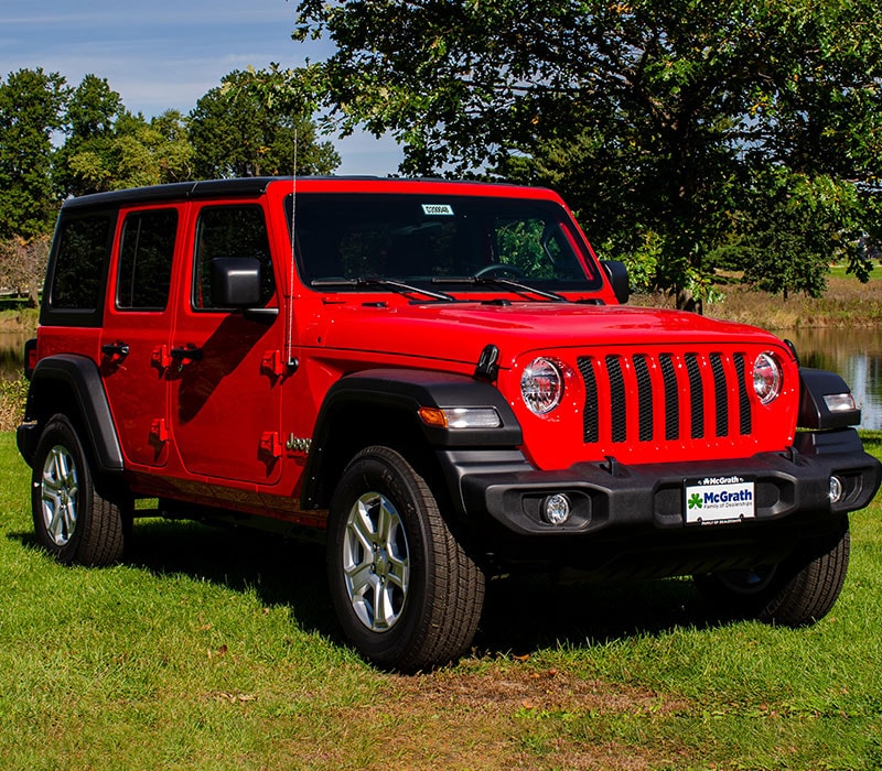 2020 Red Jeep Wrangler Exterior side view parked in a park