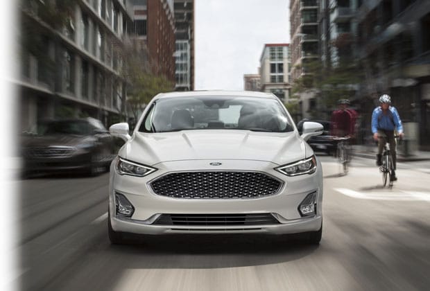 2020 Ford driving down the street