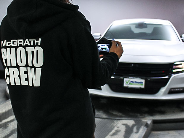 McGrath staff taking photo of Dodge Charger