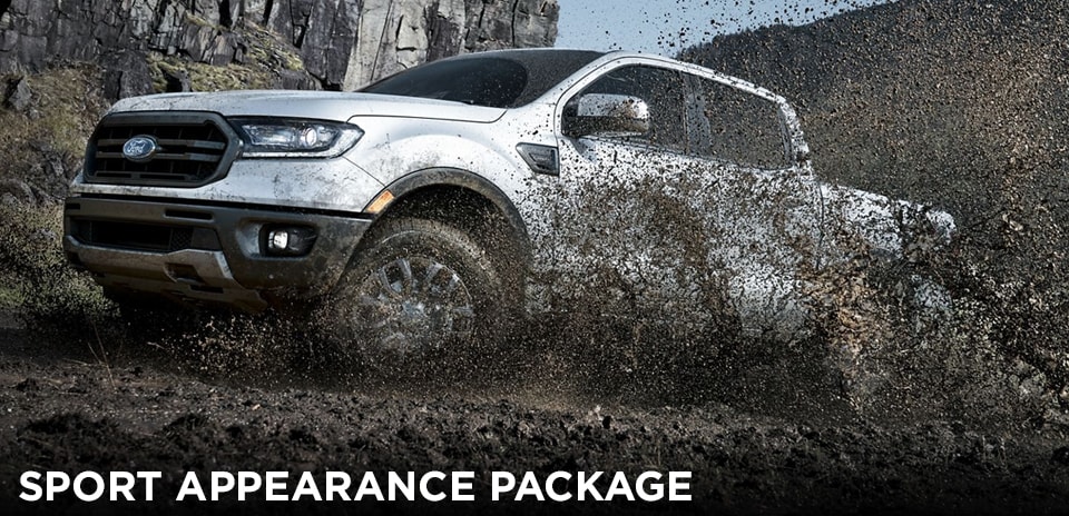 2019 Magnetic Ford Ranger Sport Appearance Package driving through mud