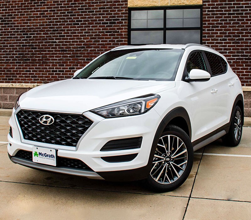 2021 Hyundai Tucson parked next to building