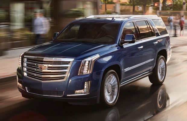 2018 Cadillac Escalade driving through the city