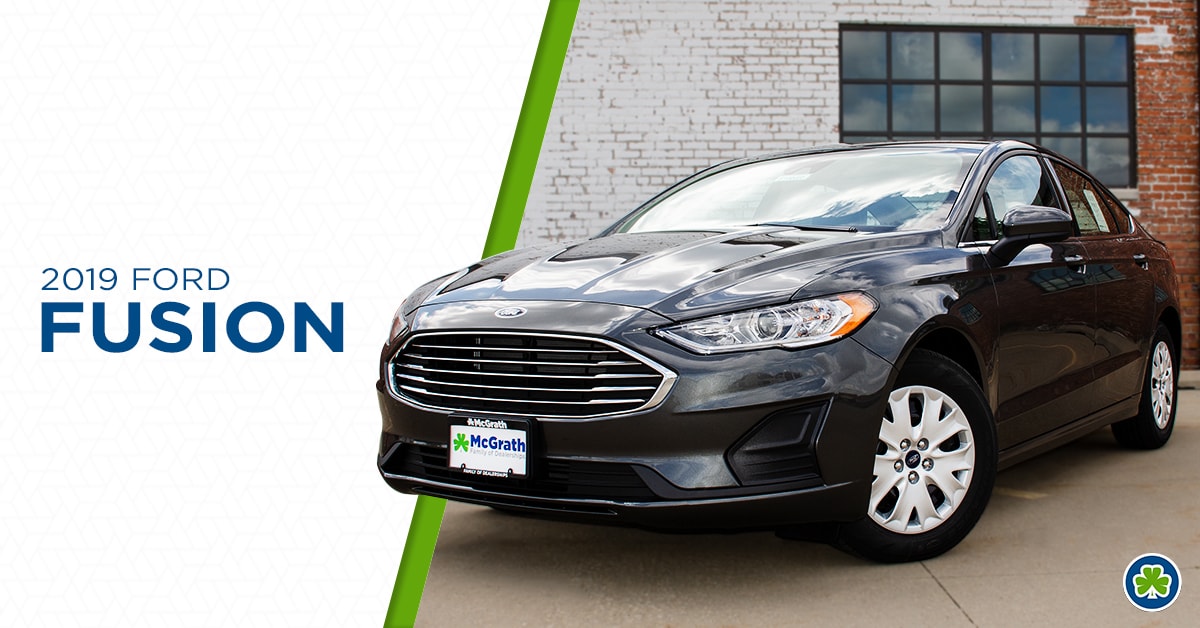 2019 Ford Fusion parked next to a brick wall
