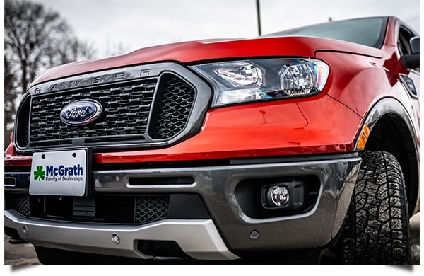 2019 Saber Orange Ford Ranger parked in dealer lot