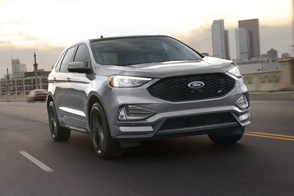 2024 Ford Edge driving down a city highway