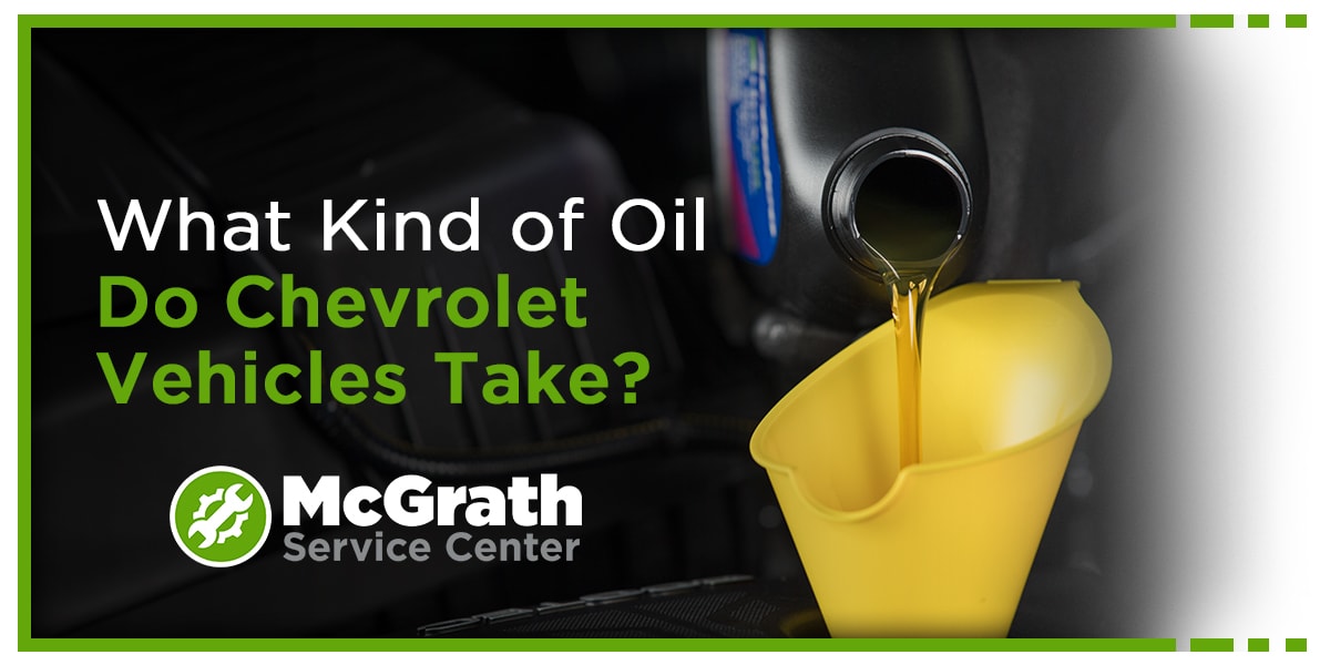 Person putting oil into a vehicle - What Kind of Oil Do Chevrolet vehicles take?