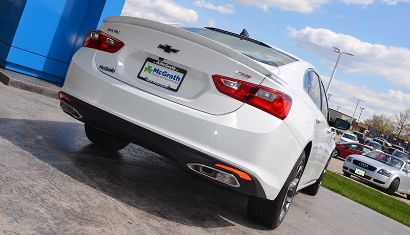 2019 Chevy Malibu RS rear exterior parked outside of a building 