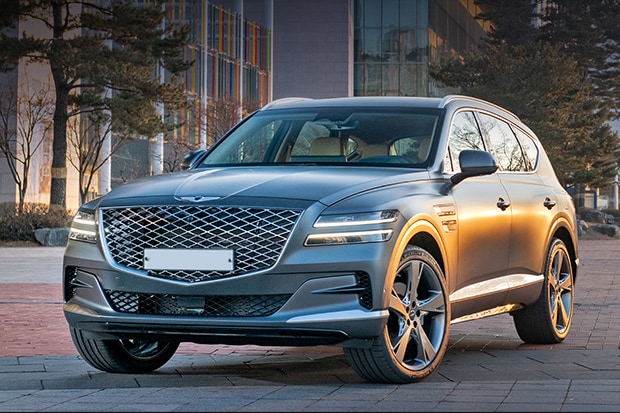 2021 Grey GV80 parked in front of brick