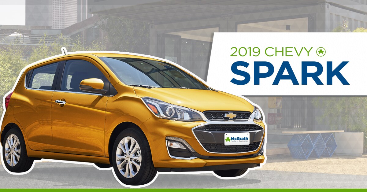 2019 Orange Burst Chevy Spark parked