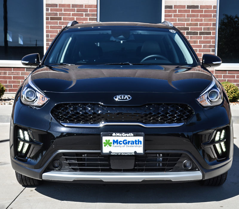 2020 Kia Niro parked next the building front grille and headlights