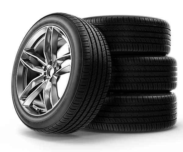 tires sitting on the ground stacked