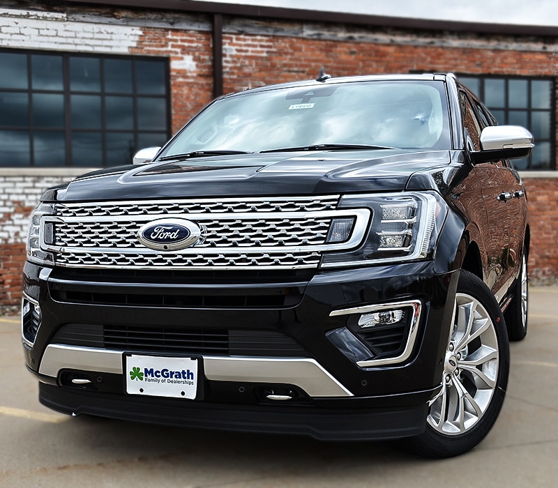 2019 black Ford Expedition parked in front of brick building front exterior