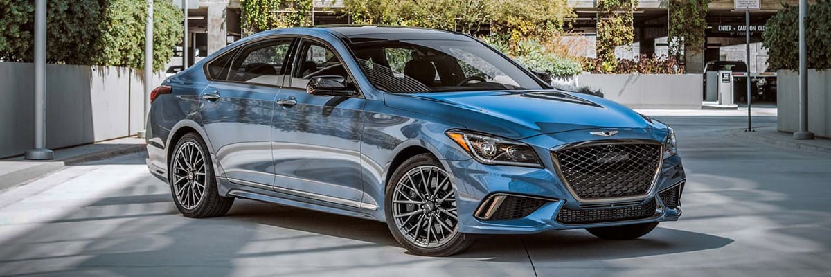 Blue 2019 G80 Sport trim parked in a courtyard