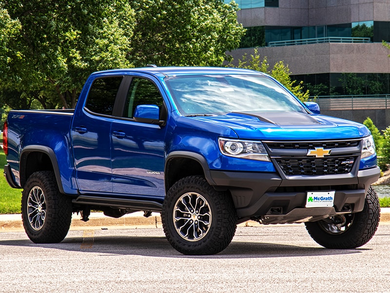 2019 Kinetic Blue Metallic Chevy Colorado Exterior Parked near a business