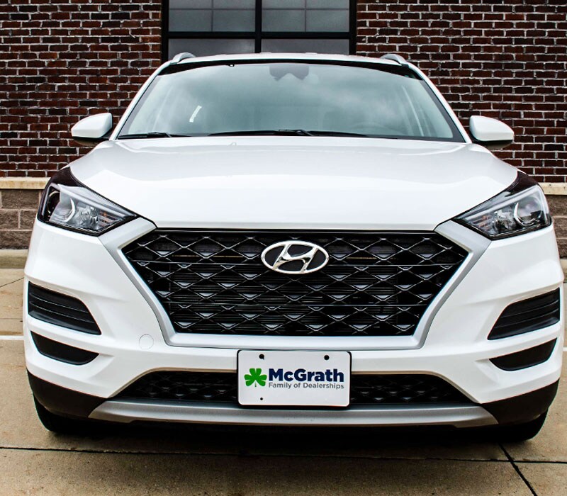 2021 Hyundai Tucson front grille exterior parked next to building