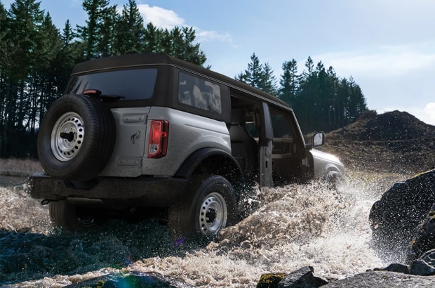 Bronco off-roading through water