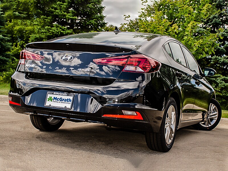 2020 Black Hyundai Elantra parked next to trees