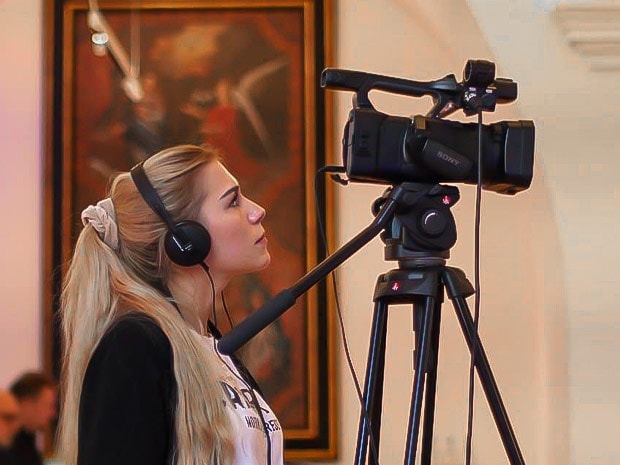 Woman filming live event