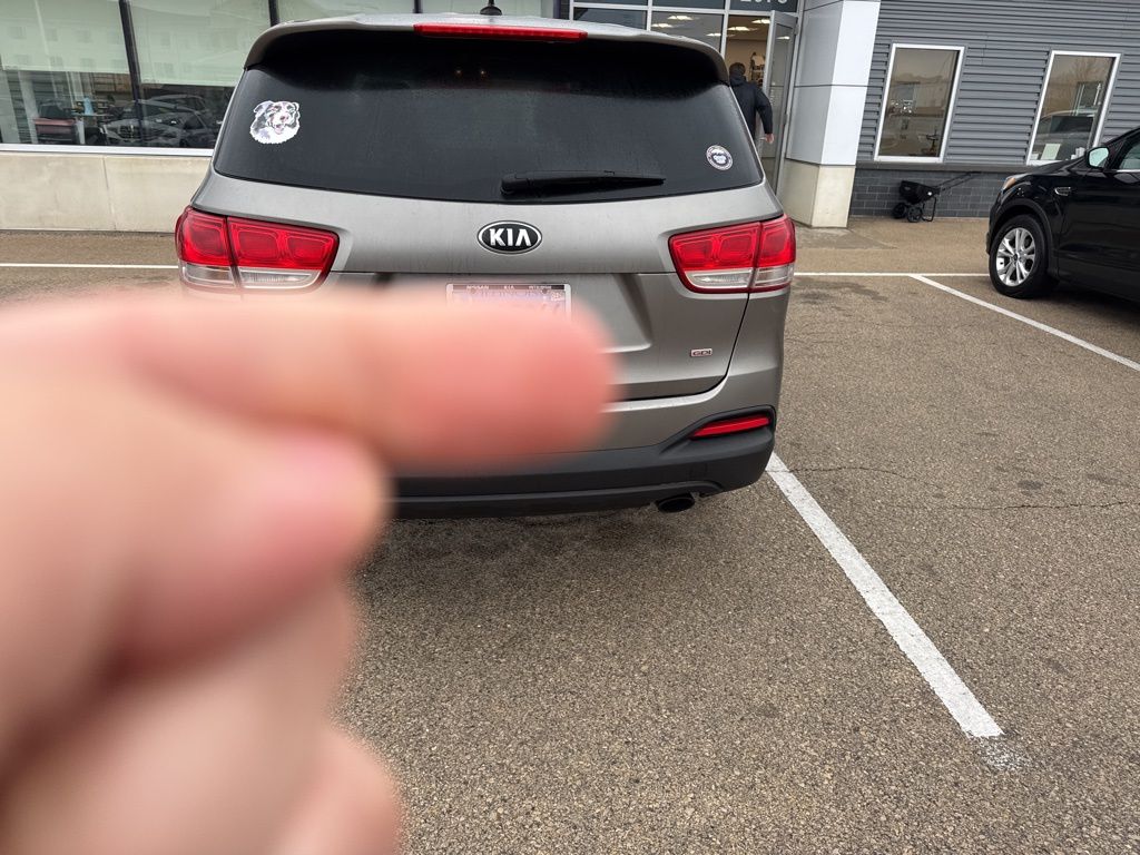 Used 2016 Kia Sorento L with VIN 5XYPG4A32GG004047 for sale in Dubuque, IA