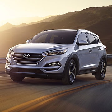 2017 Hyundai Tucson driving at sunset