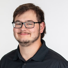 Staff member Christian Merrick from 5245f8233ba4