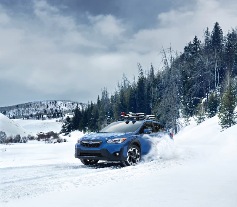 2021 Subaru Crosstrek driving through deep snow