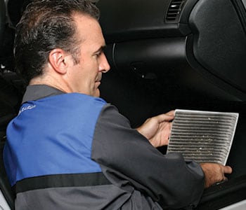 Subaru Technician replacing cabin air filter